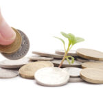 concept: coins being added to a growing fund of donations